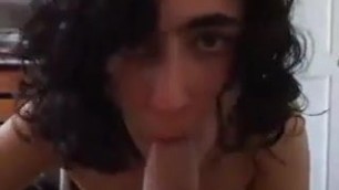 Girl with curly hair gets on her knees to suck dick